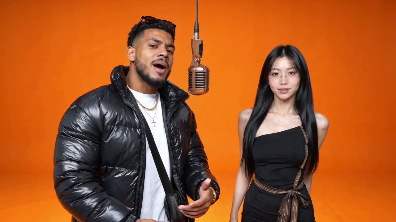A couple in the orange booth